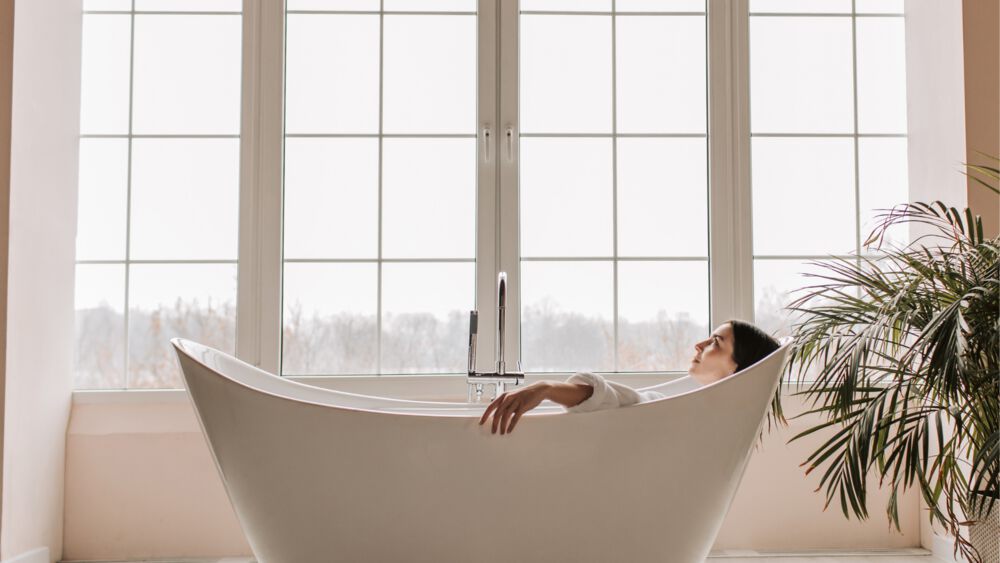 A woman relaxes in the bathtub